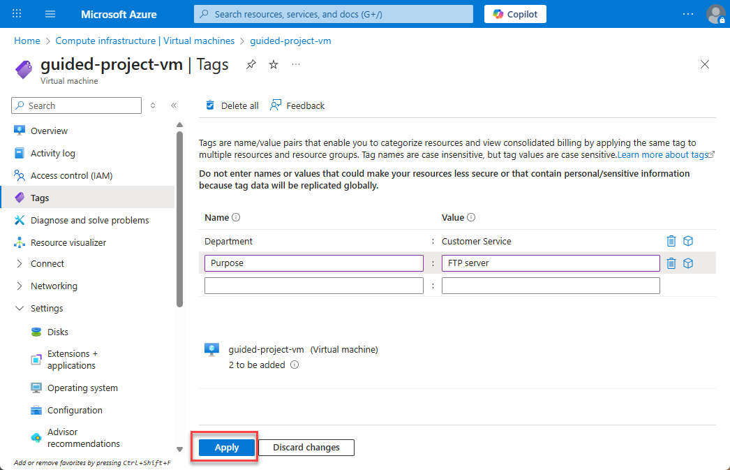 Screenshot of the virtual machine tags page with two tags filled in and the Apply button highlighted.