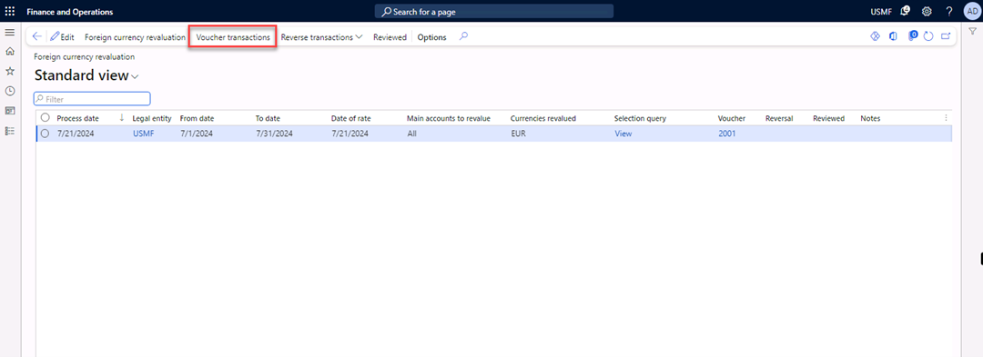 Foreign currency revaluation page with the Voucher transactions button highlighted.